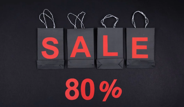 A group of black bags with red lettersDescription automatically generated